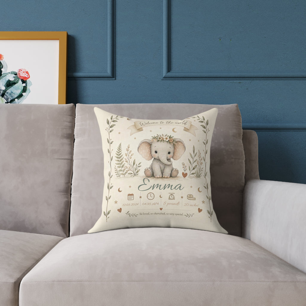 Close-up of personalized baby elephant pillow with birth details text